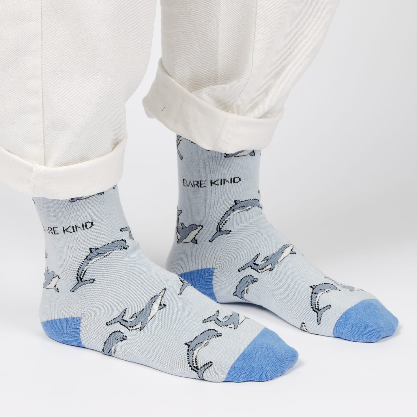 model wearing blue dolphin bamboo socks