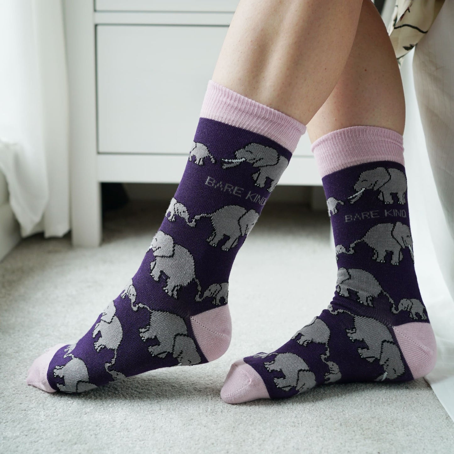 model wearing purple elephant bamboo socks