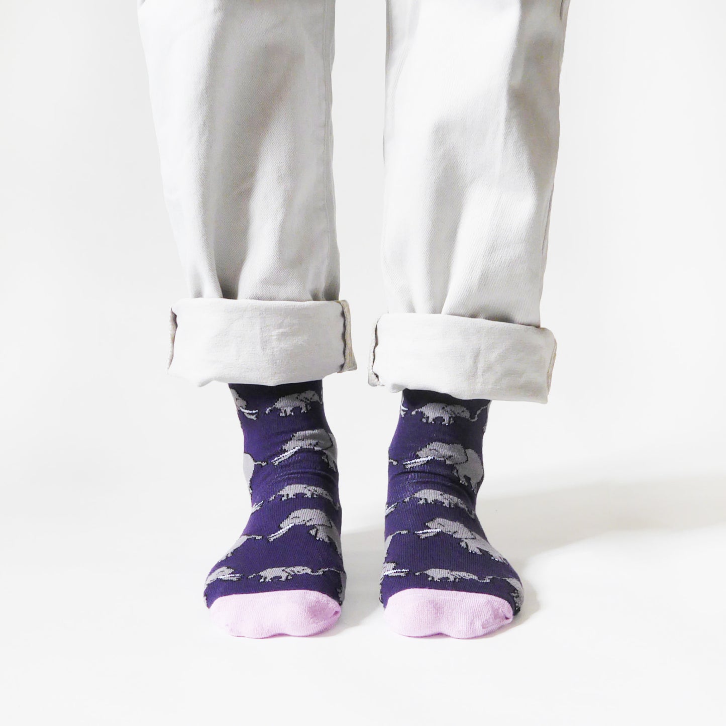 front view of standing model wearing purple and pink elephant bamboo socks