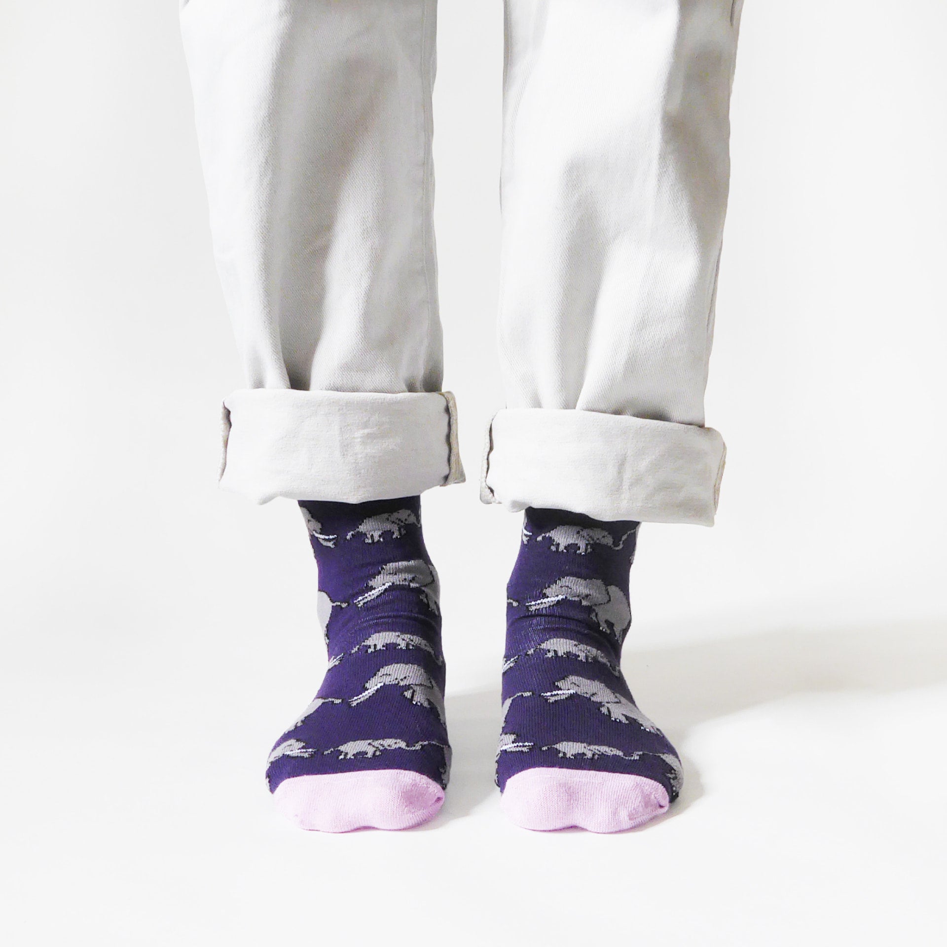 front view of standing model wearing purple and pink elephant bamboo socks