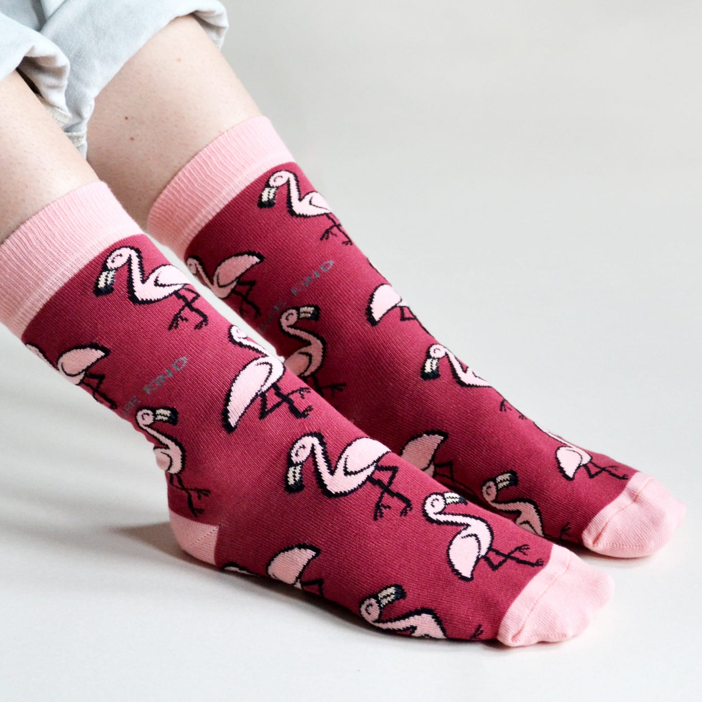 model wearing pink flamingo bamboo socks