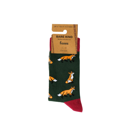 Green sock with fox pattern and 'Bare Kind' packaging on a white background
