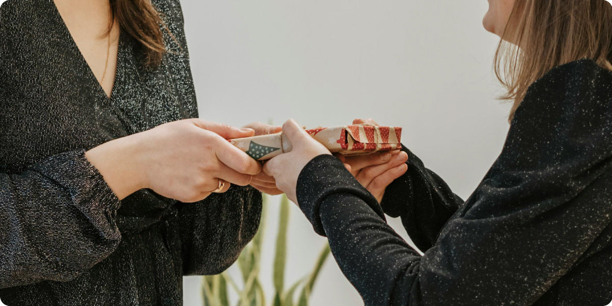 friends giving gift each other