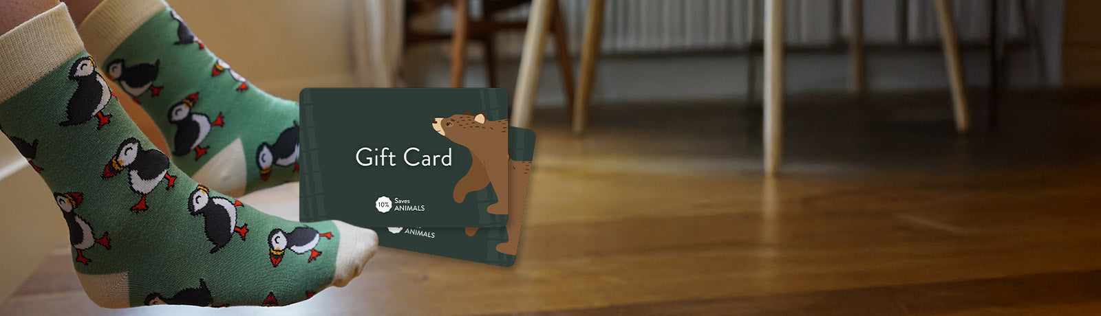 Person wearing green puffins bamboo socks