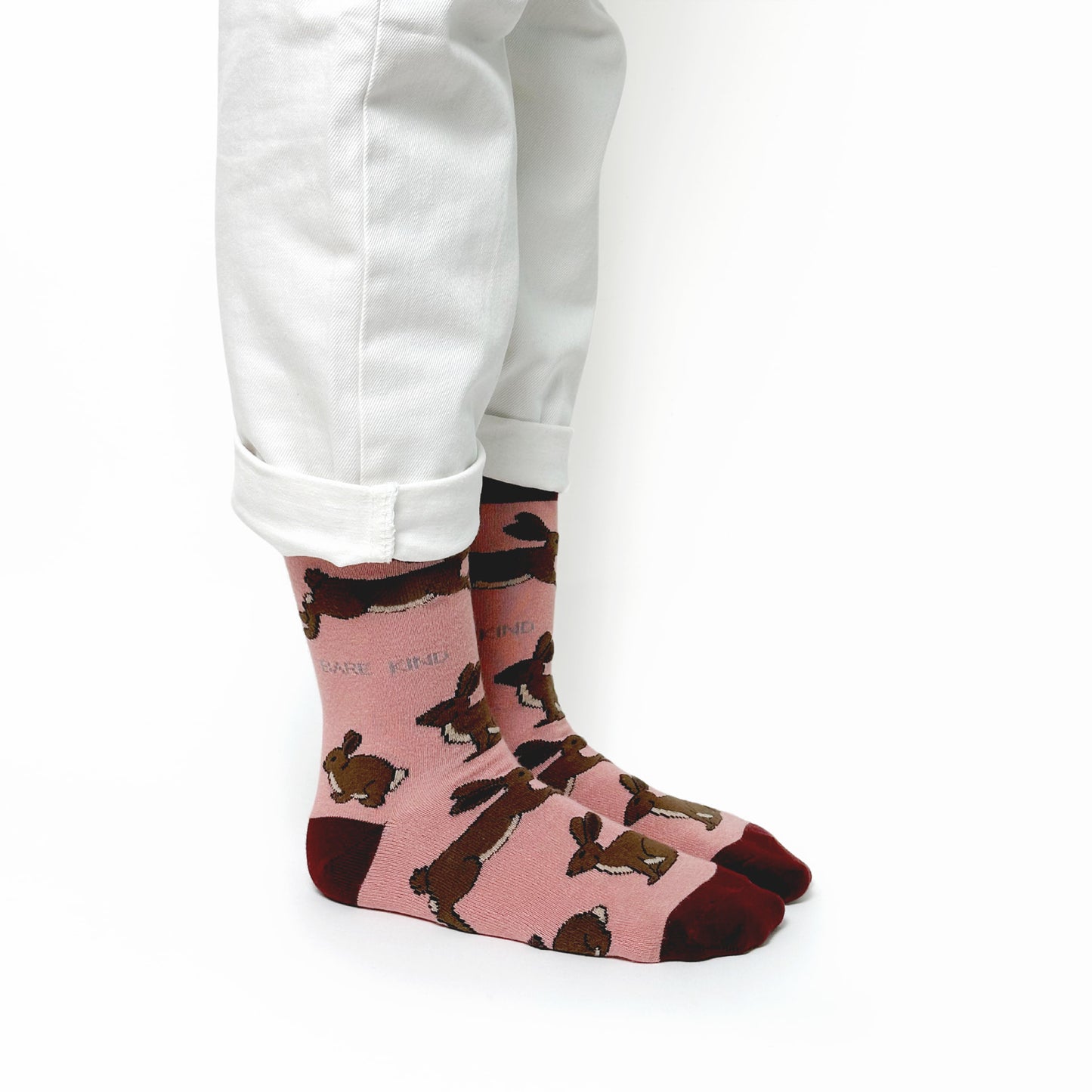 model wearing pink hare bamboo socks, side view