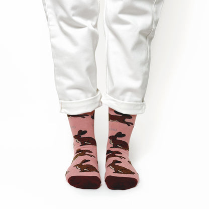 model wearing pink hare bamboo socks