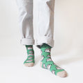 standing model wearing green bamboo hedgehog socks