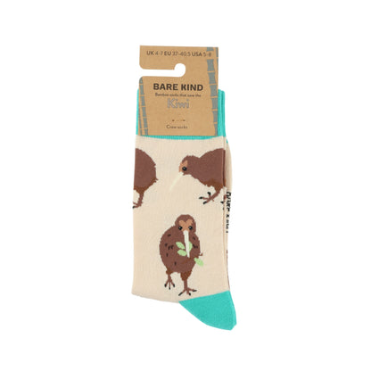 Beige sock with brown animal design and green accents, featuring 'Bare Kind' packaging.