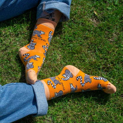 model wearing orange lemur bamboo socks