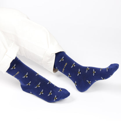 model wearing navy blue bee motif bamboo socks