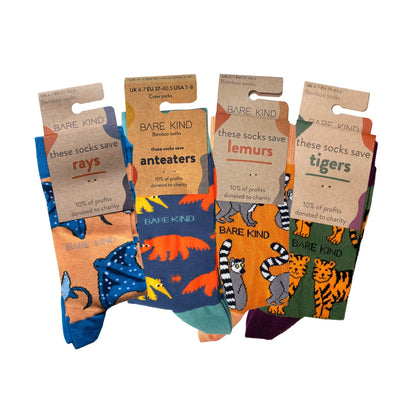 packaging flat lays of orange rays, anteater, lemur and tiger bamboo socks