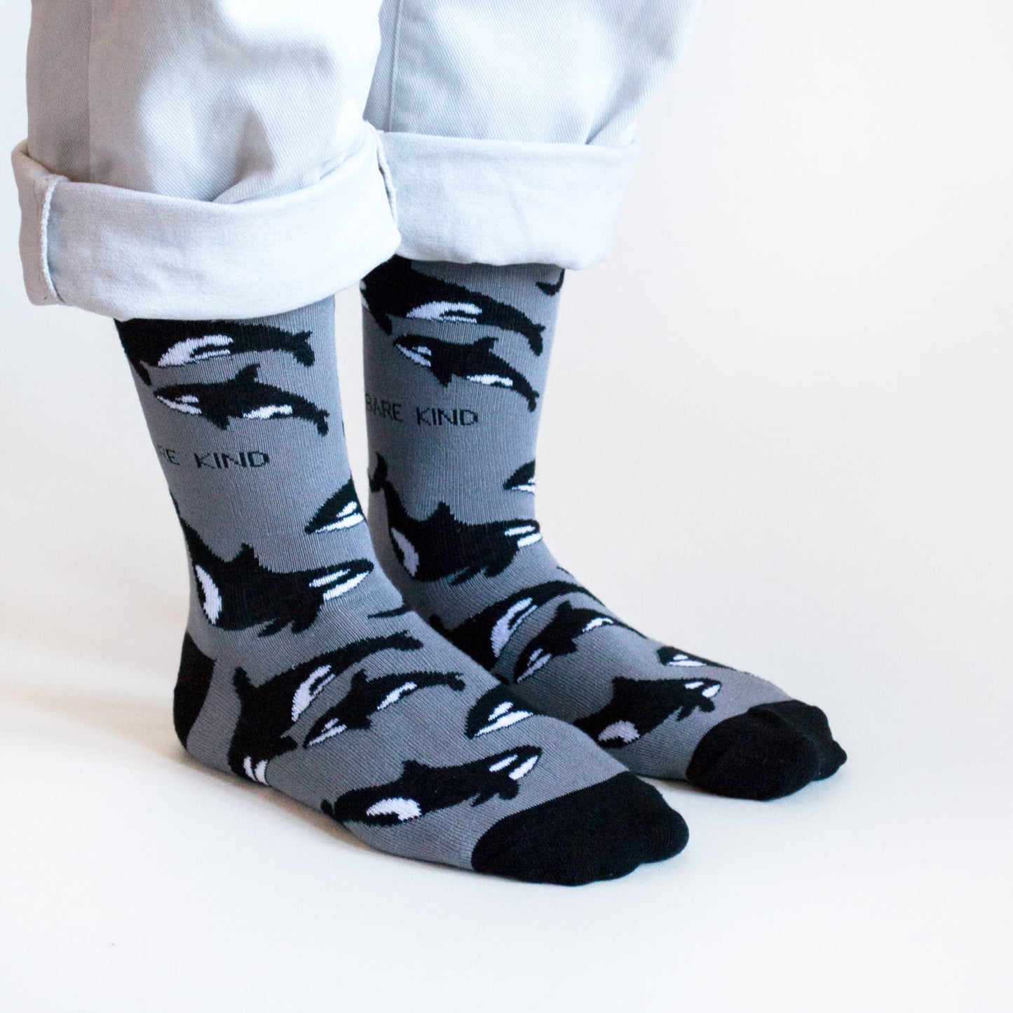 model wearing black and grey orca bamboo socks