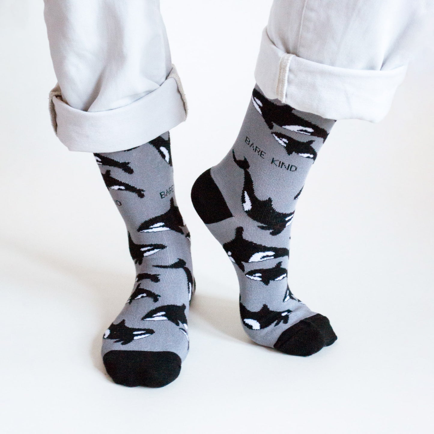 model wearing black and grey orca bamboo socks