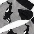 closeup of black and white bamboo trainer ankle socks with orca design