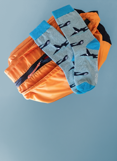 a pair of blue orcas socks.