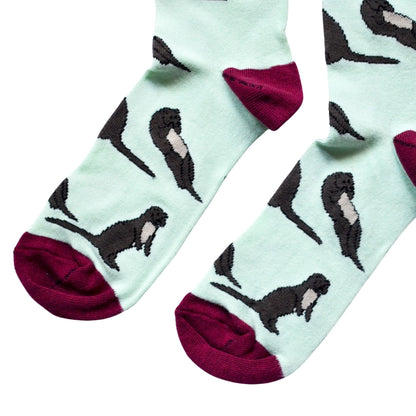 flat lay of light green otter bamboo socks