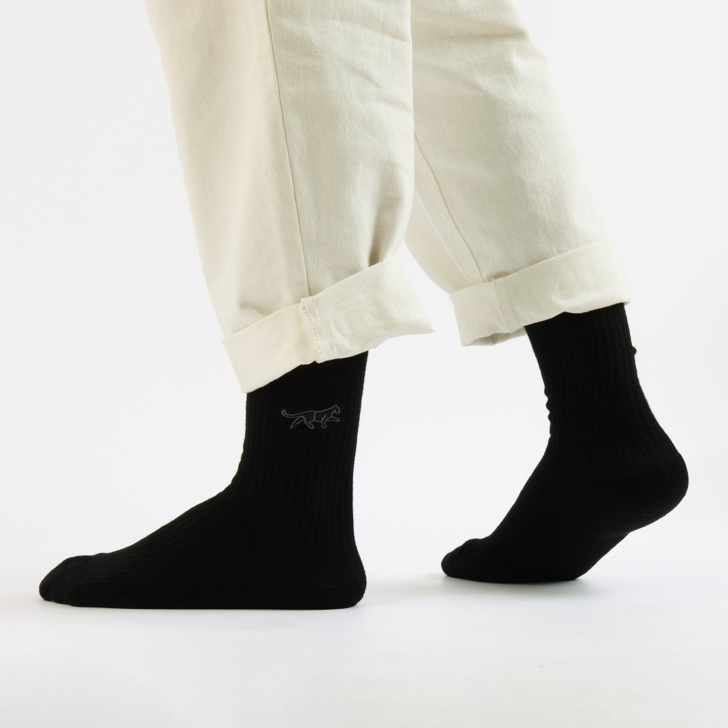 Model wearing black panther ribbed bamboo socks