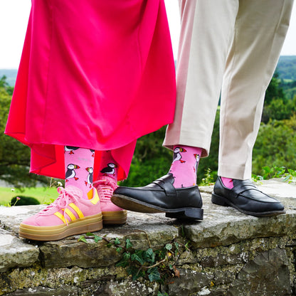 man and woman wearing pink puffin bamboo socks