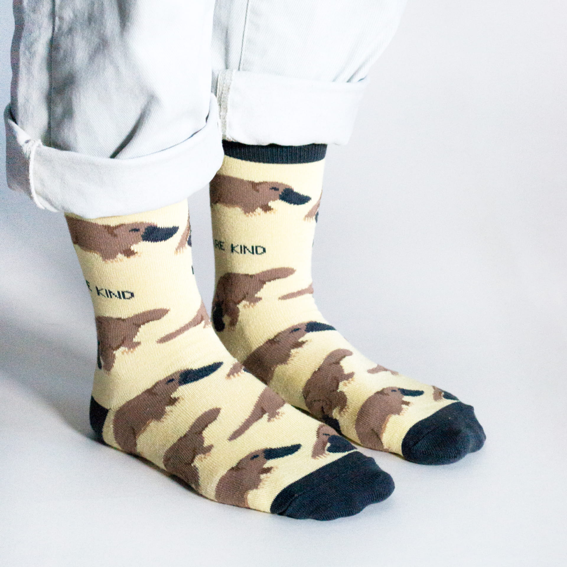 model wearing yellow platypus bamboo socks