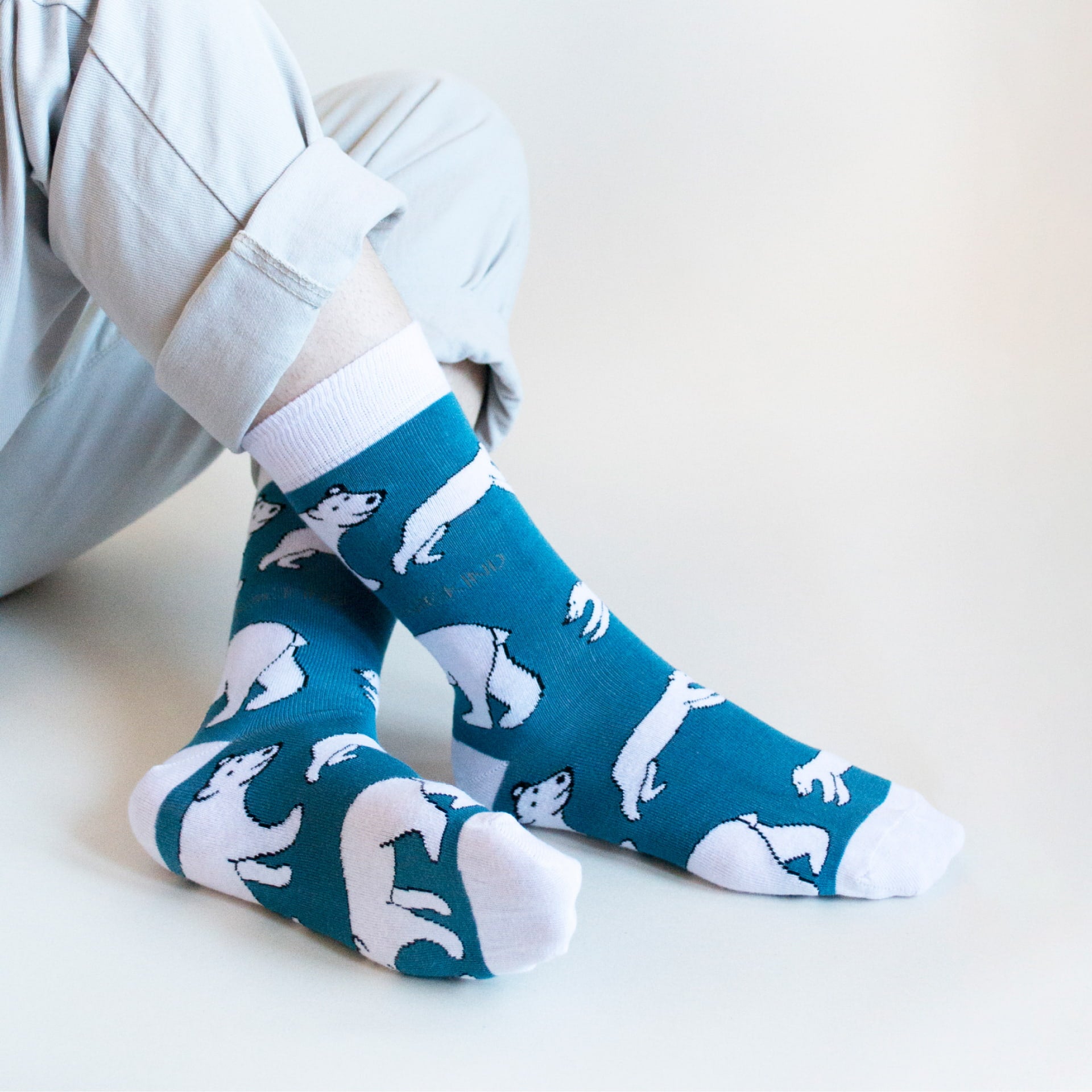 model wearing blue white polar bear bamboo socks