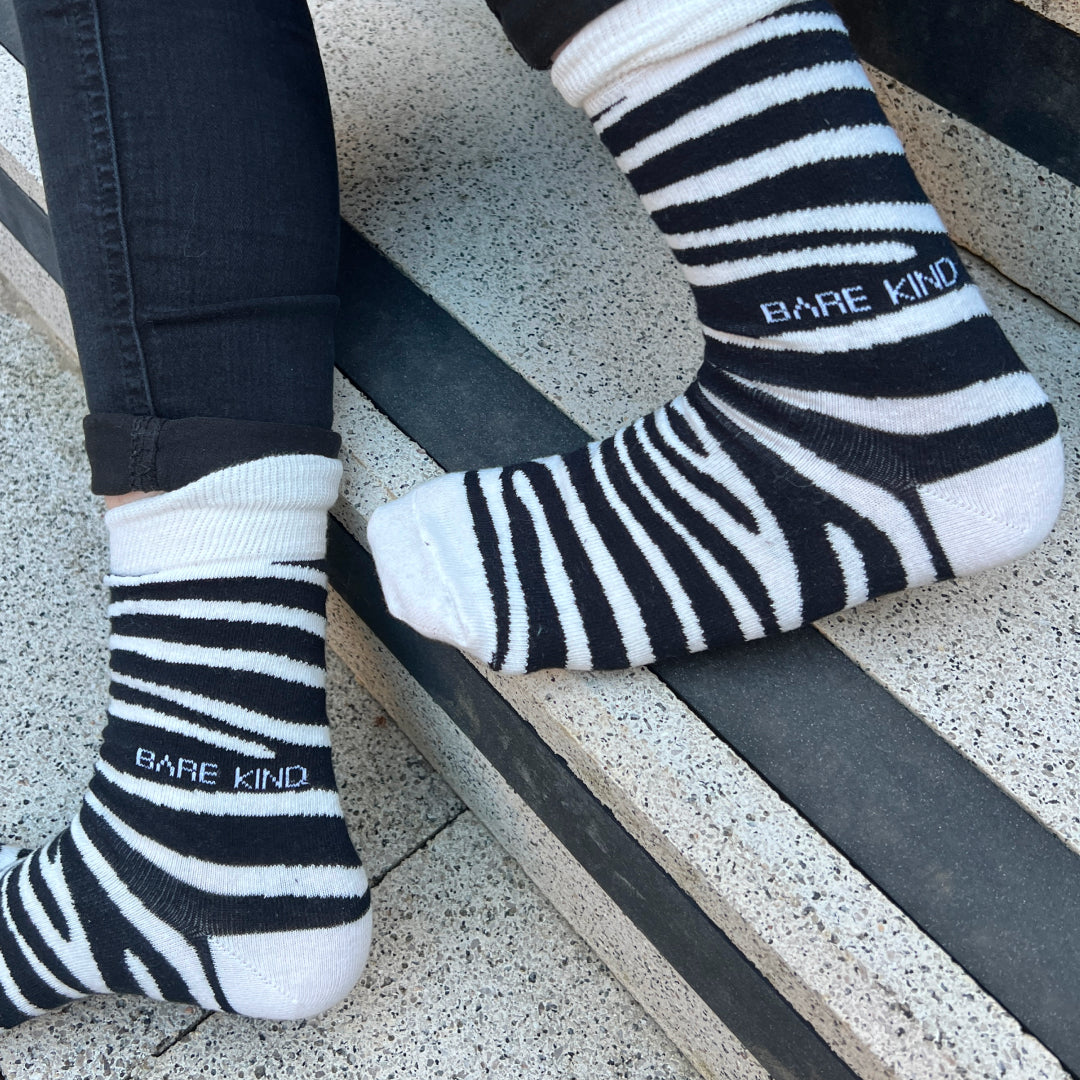 Model wearing zebra bamboo socks