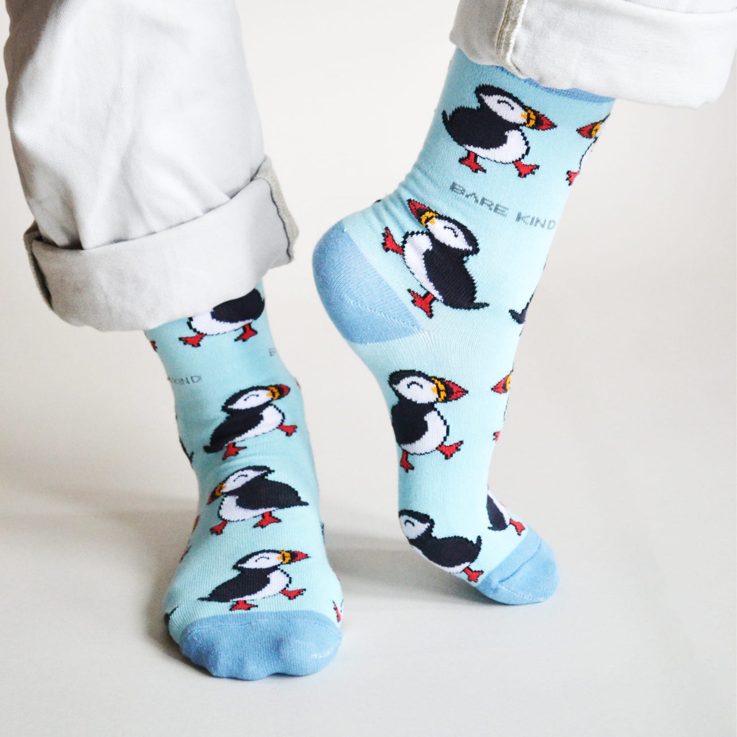 model wearing blue puffin bamboo socks