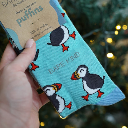 blue puffin bamboo socks in front of Christmas tree