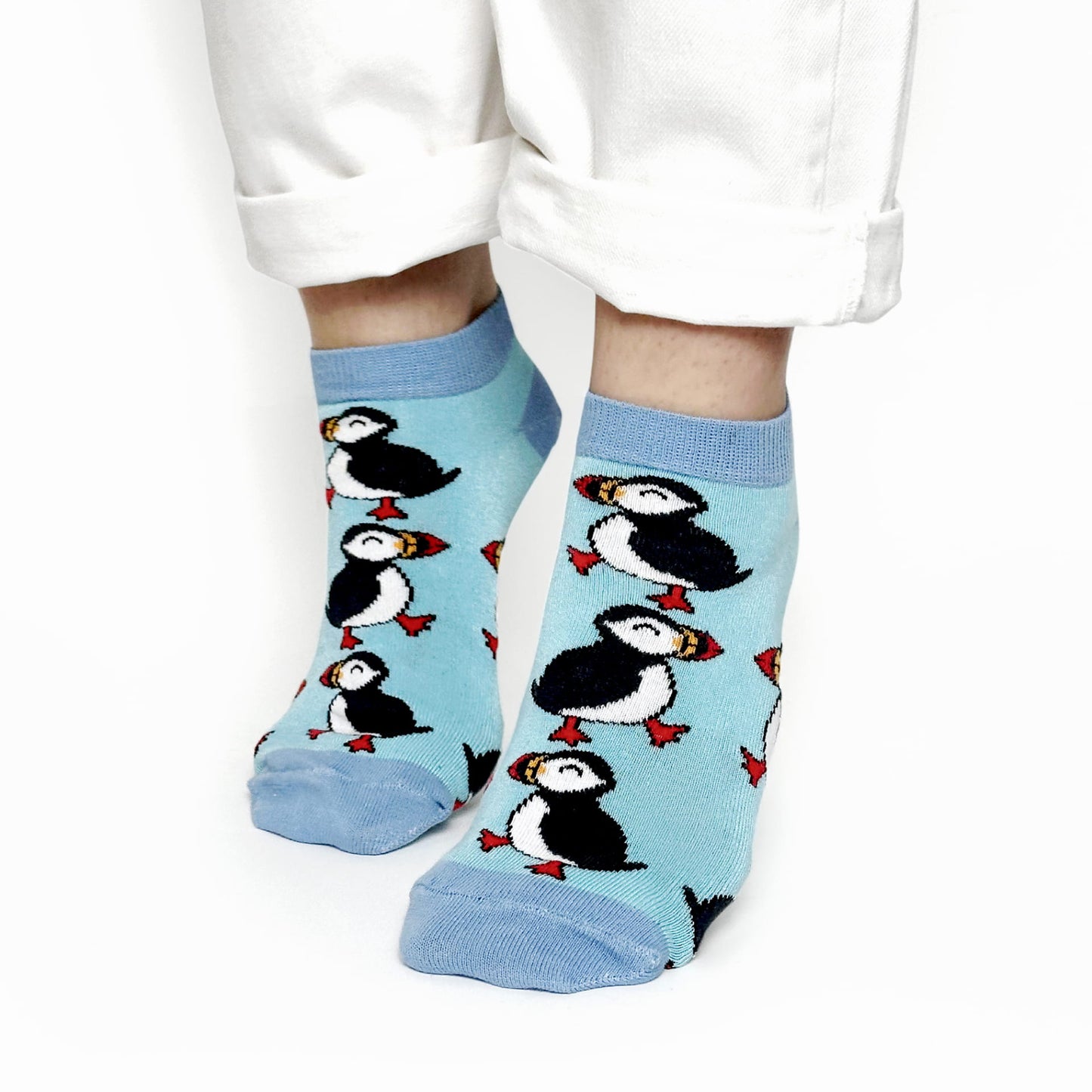 model wearing blue puffin trainer bamboo socks