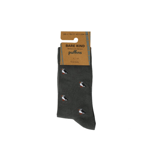 Dark gray sock with puffin design and Bare Kind packaging on a white background