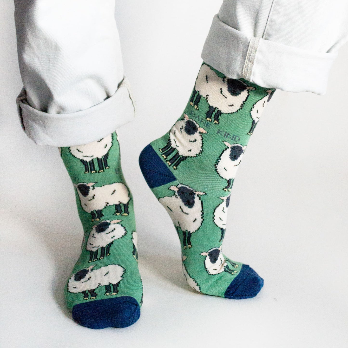 model wearing green sheep bamboo socks