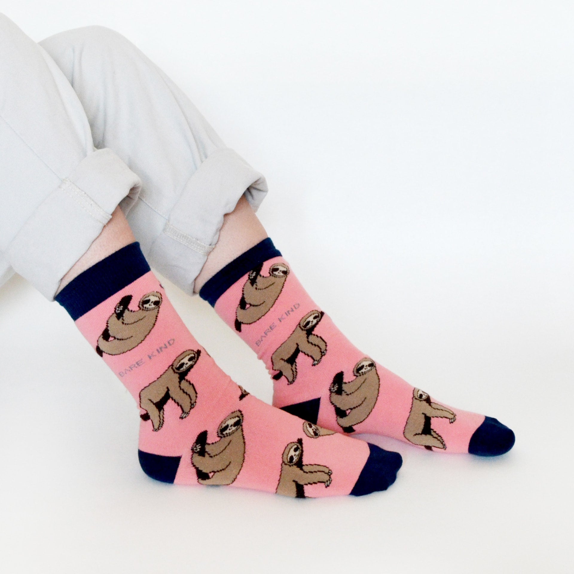 model wearing pink sloth bamboo socks