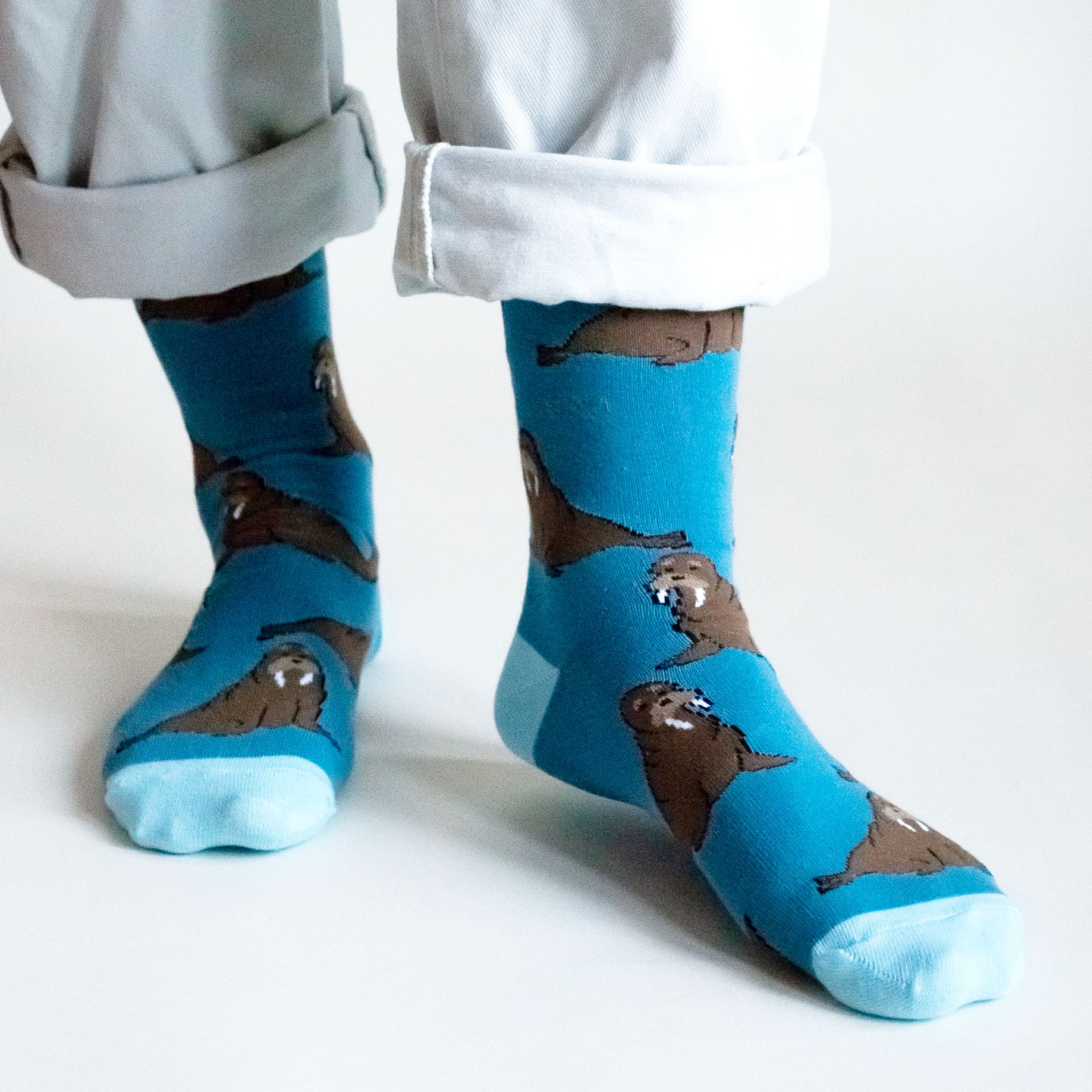 Model wearing blue walrus bamboo socks