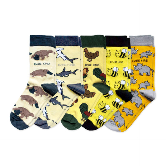 flat lays of yellow platypus, shark, chicken, bee and rhino bamboo socks