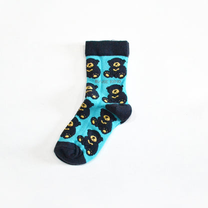 single flat lay of blue bamboo socks for kids in woven sun bear design