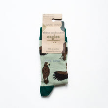 folded flat lay of green eagle bamboo socks in 100% recyclable cardboard packaging