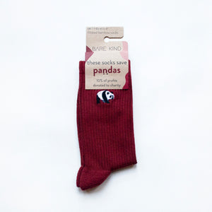 folded flat lay of ruby red panda bamboo ribbed socks in 100% recyclable packaging 