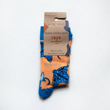 folded flat lay of coral bamboo ray socks in 100% recyclable cardboard packaging