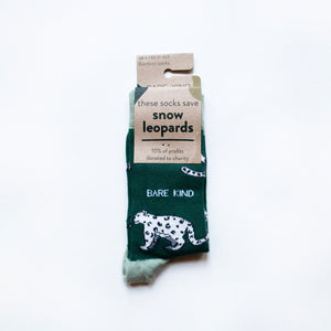 folded flat lay of green snow leopard bamboo socks in 100% recyclable cardboard packaging