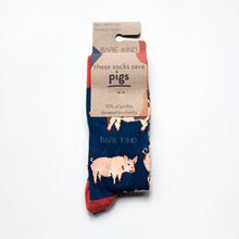 folded flat lay of navy blue pig bamboo socks in 100% recycled cardboard packaging