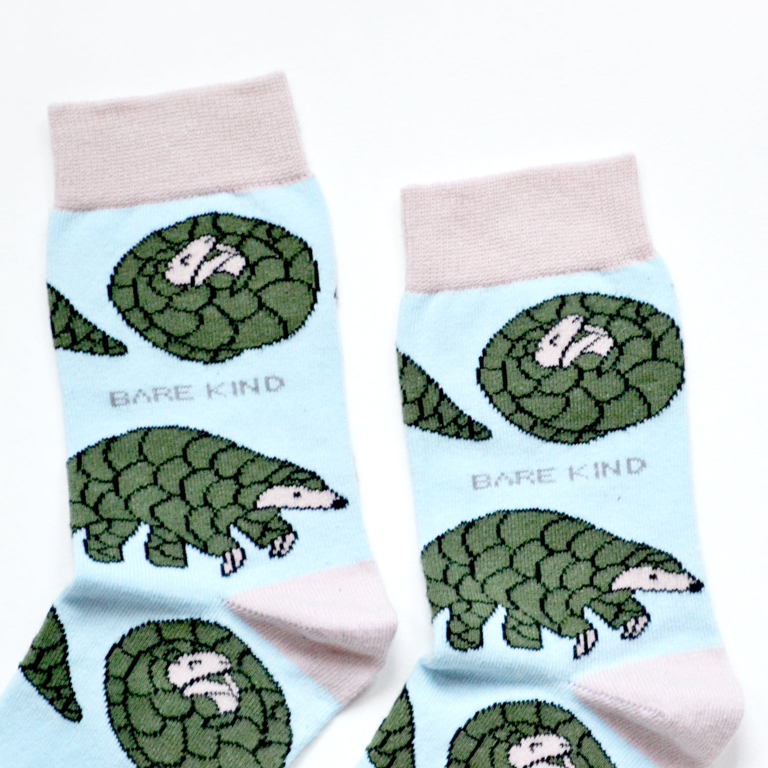 cuff closeup flat lay of pastel blue pangolin bamboo socks