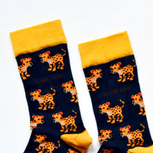 toe closeup flat lay of navy blue bamboo socks featuring leopard designs
