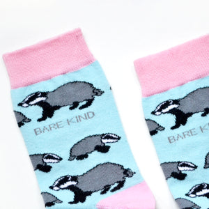 Blue and pink badgers bamboo socks, closeup of cuffs flat lay