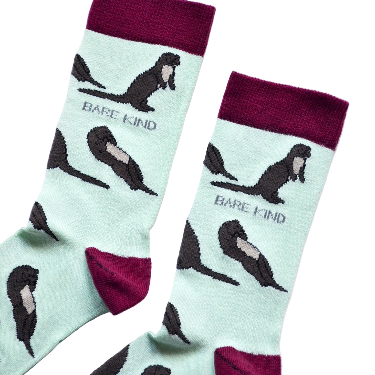 cuff closeup flat lay of pastel green otter socks 