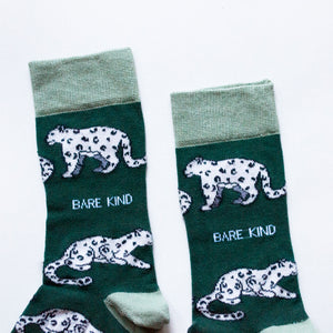 cuff closeup flat lay of green snow leopard bamboo socks