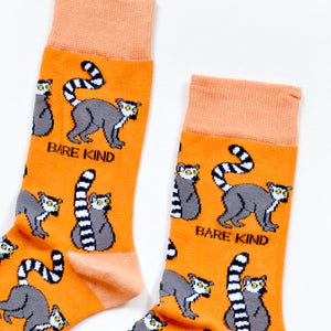 cuff closeup of flat lat of orange lemur bamboo socks 