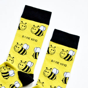 cuff closeup flat lay of black and yellow bee bamboo socks