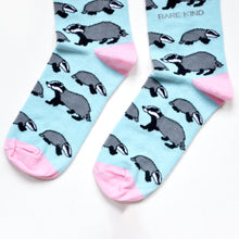 Blue and pink badgers bamboo socks, closeup of toes flat lay