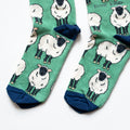 toe closeup of green bamboo sheep socks with navy heel and toe