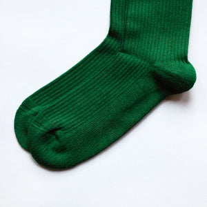 toe closeup flat lay of emerald green ribbed bamboo socks