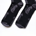 toe closeup flat lay of black panther socks